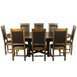 A contemporary extendable oak table and eight chairs,