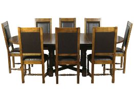 A contemporary extendable oak table and eight chairs,