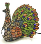 A Tiffany style peacock table lamp by the Kind Light Manufactory Ltd, electrified,