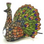 A Tiffany style peacock table lamp by the Kind Light Manufactory Ltd, electrified,