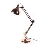 A contemporary gold coloured anglepoise style lamp table lamp,
