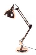 A contemporary gold coloured anglepoise style lamp table lamp,