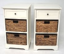 A pair of bedside cabinets, three drawers, two containing wicker baskets,