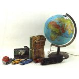 A collection of toys, including a desktop revolving atlas lamp,