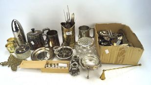 An assortment of silver plated and metalware, including: a cocktail shaker, mugs,
