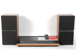 A Bang & Olufsen beocenter 7007 and a pair of Beovox S 80.