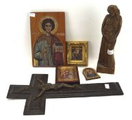 A collection of religious related items, including icons, crosses, figures,