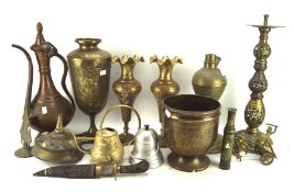 Assorted Middle Eastern brassware, including: vases engraved with scrolling foliage, ewers,