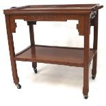 An oriental style wooden trolley, with handles to either side and mounted on castors,