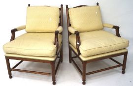 A pair of modern upholstered elbow chairs, in an 18th century style,