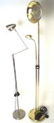 Two modern adjustable standard lamps, one a gilt metal example with two slight branches,