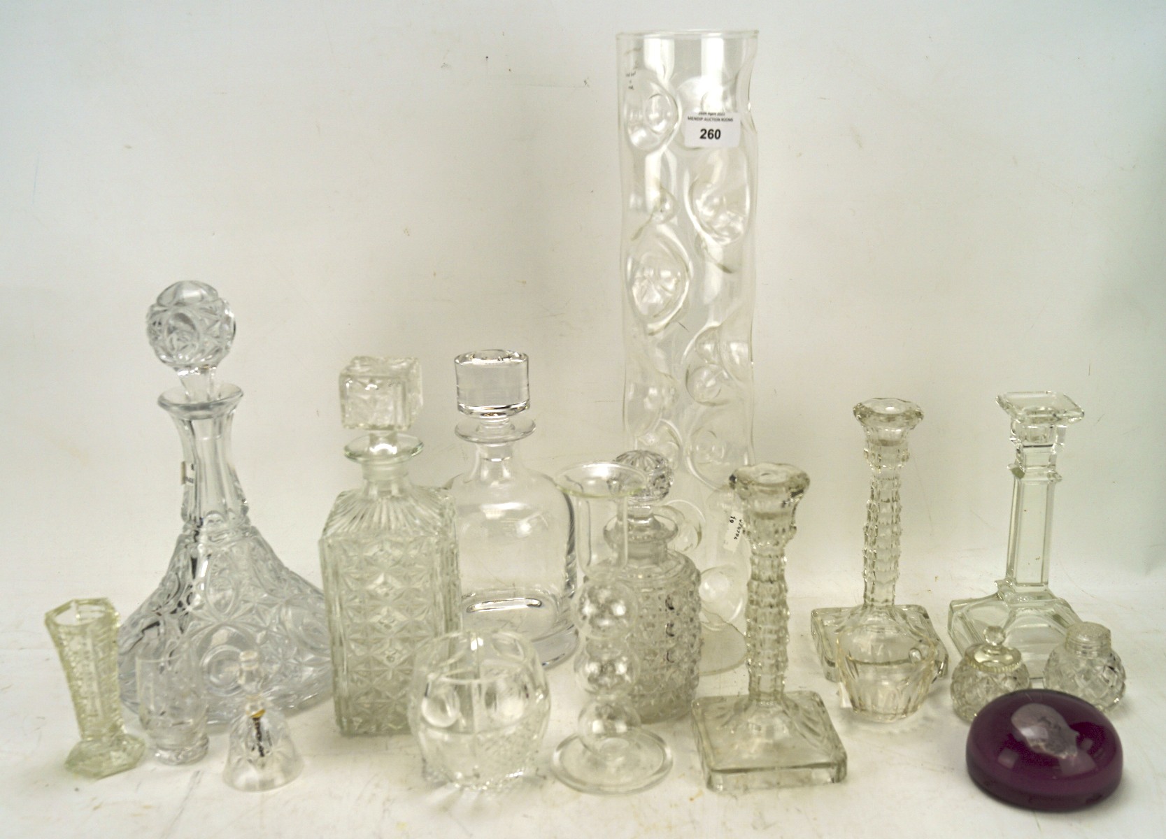 A collection of glassware, including two pairs of candlesticks, four decanters,