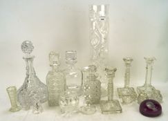 A collection of glassware, including two pairs of candlesticks, four decanters,