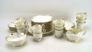 An Art Deco Paragon bone china part tea set, with blue and yellow flower and gold details,