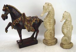 A painted ceramic horse in the Chinese style and two seahorse ornaments,