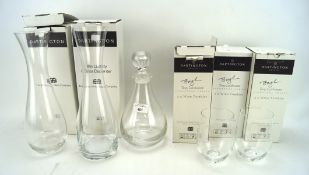 An assortment of Dartington Crystal, comprising three decanters and three pairs of wine tumblers,