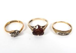 Three assorted gold rings, two set with diamonds, total weight 7.