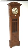 An early to mid-20th century oak and glazed longcase clock, fan-shaped relief details,