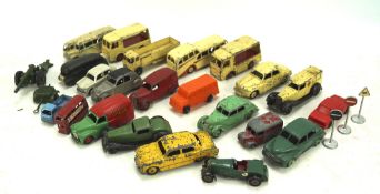 A collection of playworn Dinky diecast toy cars, including an Observation Coach,