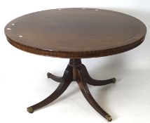 A Regency Style 20th century mahogany veneered tilt top breakfast table, of circular form,