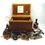 A collection of vintage tools, including weights, a roller etc,