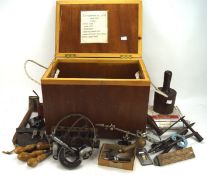 A collection of vintage tools, including weights, a roller etc,