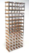 A contemporary wine rack, L52cm x D23cm x H137.