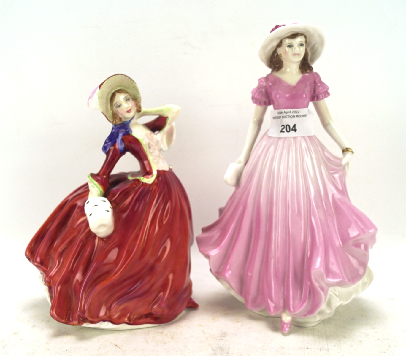Two ceramic figures of ladies,