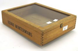 A Henri Winterman glazed wooden cigar display case, the wooden frame stamped 'Henri Wintermans',