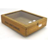 A Henri Winterman glazed wooden cigar display case, the wooden frame stamped 'Henri Wintermans',