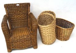 A contemporary child's wicker chair and two wicker baskets,