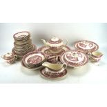 A Victoria pink Willow pattern pottery part dinner and tea service, with gilt rims,