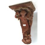 A late 19th/early 20th century terracotta wall bracket, in the form of a mermaid,