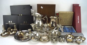 An assortment of vintage and modern silver plate and metal tablewares including salad servers,