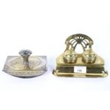 An Art Noveau brass inkwell with a blotter, each cast with scrolls,