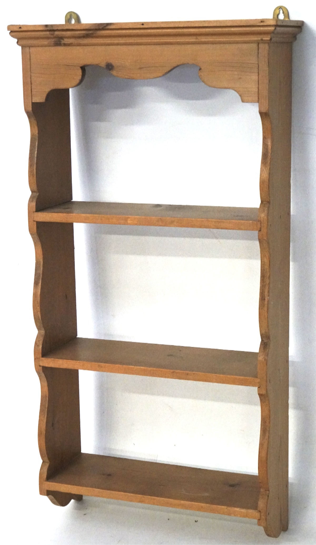 A set of contemporary pine wall shelves, with shaped details to the top and sides, L43cm x D15.
