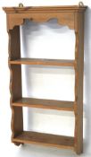 A set of contemporary pine wall shelves, with shaped details to the top and sides, L43cm x D15.