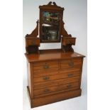 An Edwardian mahogany chest of drawers with dressing table mirror,