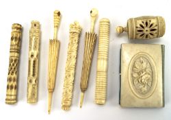 An assortment of bone and ivory sewing implements, including six needle cases, some with stanhopes,