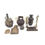 A collection of carved tribal items, including: African metal figures,a double headed vessel,