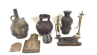 A collection of carved tribal items, including: African metal figures,a double headed vessel,