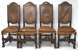 A set of four 19th century chairs, with carved mahogany frames, upholstered with brown leather,