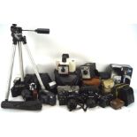 Large collection of vintage cameras and related equipment, including: a Canon T70, a Pentax MG,