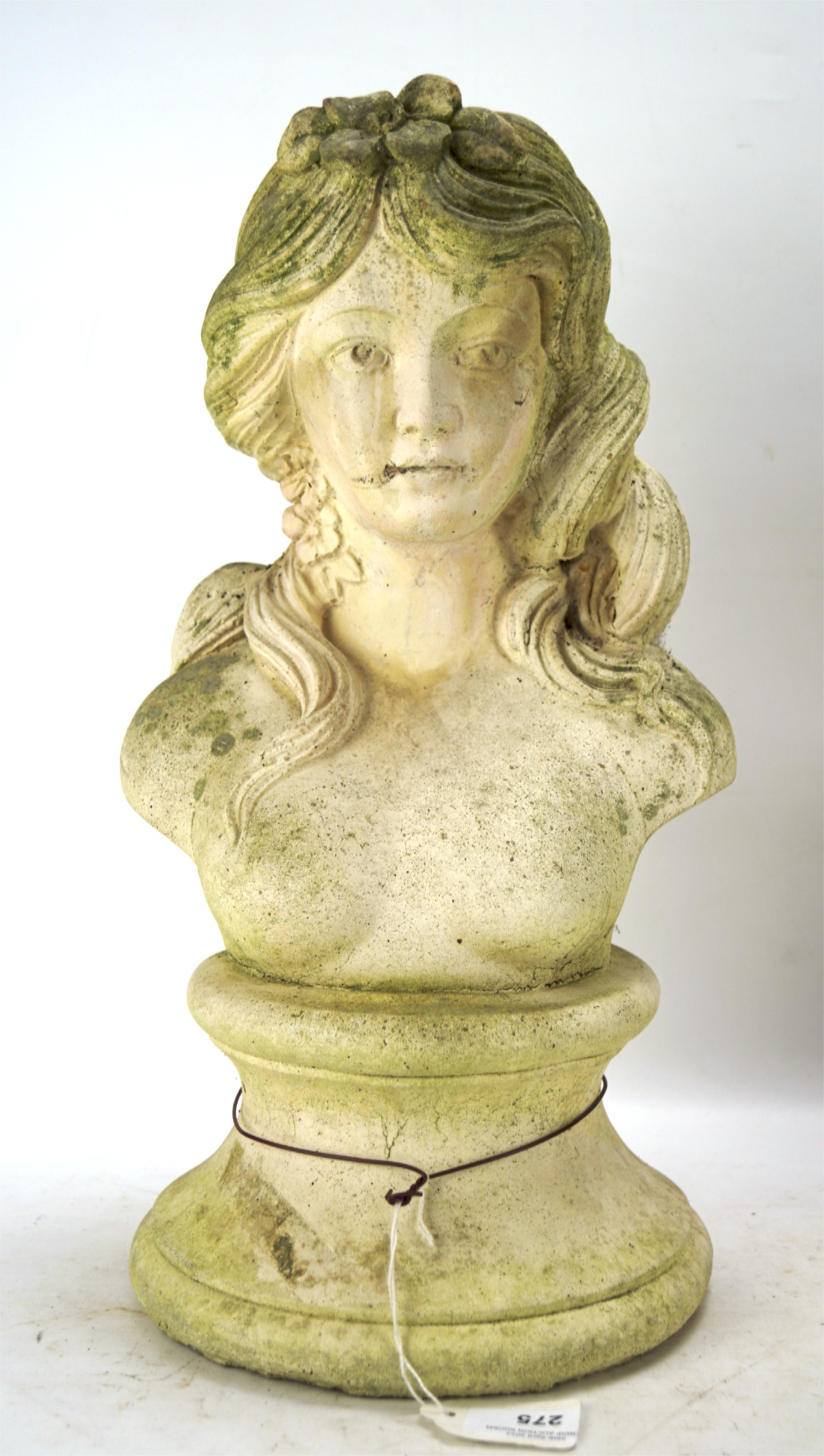 A 20th century stone garden ladies bust, with single flower in her hair,