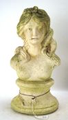 A 20th century stone garden ladies bust, with single flower in her hair,