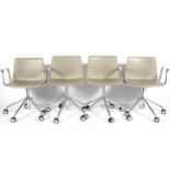 A set of four Andreu World (National Design Award Winning Company 2007) faux leather chairs,