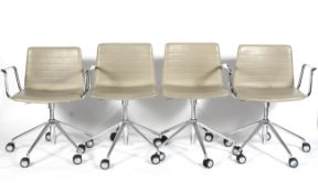 A set of four Andreu World (National Design Award Winning Company 2007) faux leather chairs,