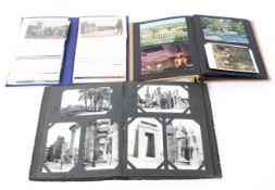 A group of early to mid 20th century albums and postcards, with views of Egypt, Wales,