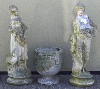 Two weathered reconstituted stone statues, possibly Little Bo Peep and Little Boy Blue,