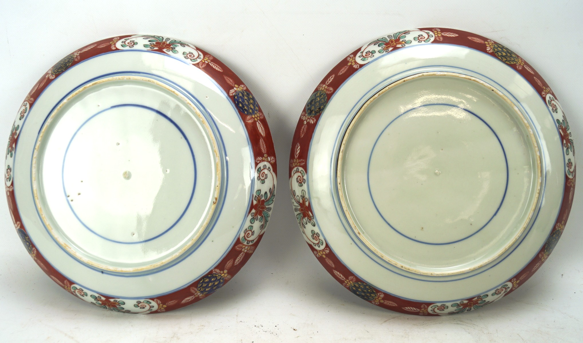 Two late 19th century Japanese Imari plates, each with a jardiniere of flowers, - Image 2 of 2